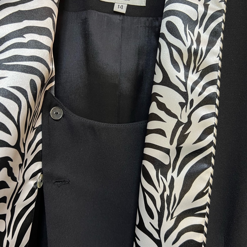 Beautiful black dressy jacket, black & white trim. Art decor rhinestone hooks.